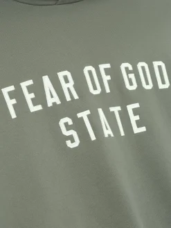 Genser<Fear of God Essentials 90S Fit Fleece Hoodie Hettegenser Lysebrun